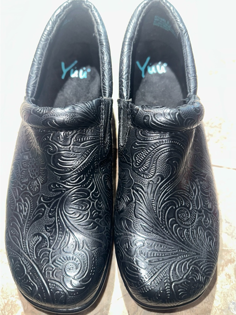Yuu Black Embossed Slip-On clogs for women